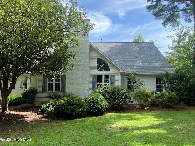 exterior space featuring a lawn