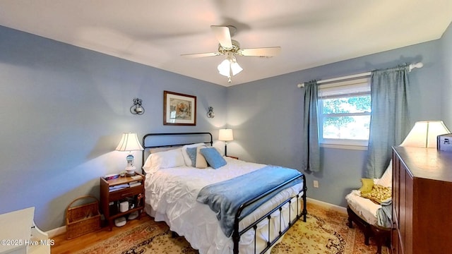 bedroom featuring ceiling fan and light hardwood / wood-style floors