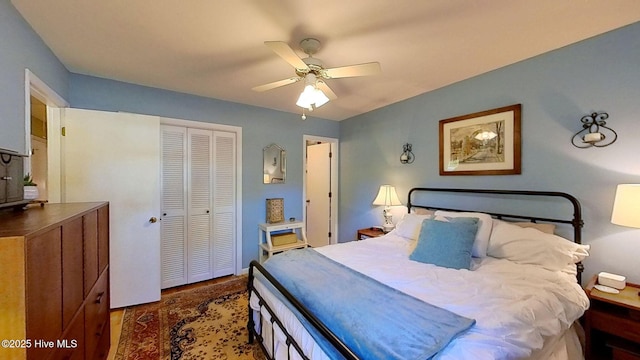 bedroom featuring ceiling fan and a closet