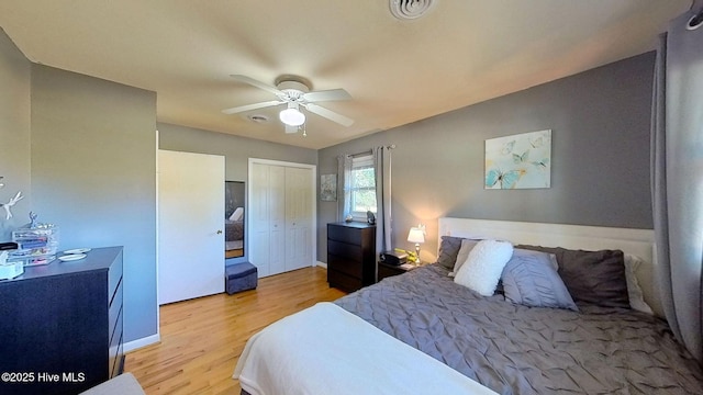 bedroom with ceiling fan and light hardwood / wood-style flooring