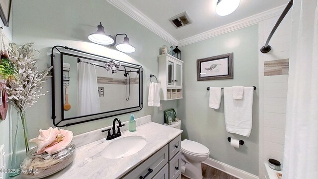 bathroom featuring vanity, crown molding, wood-type flooring, toilet, and curtained shower