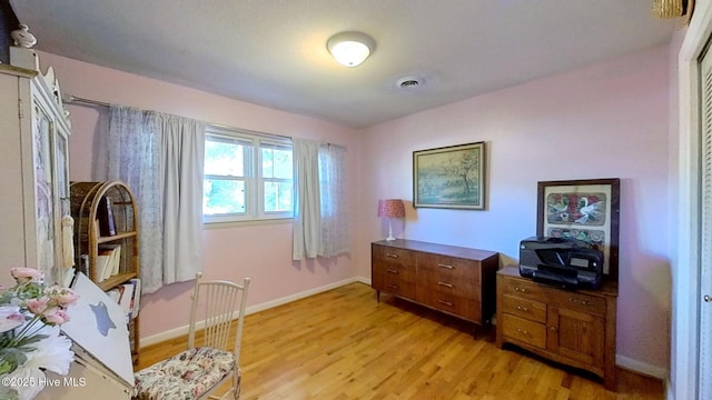 office with light hardwood / wood-style floors