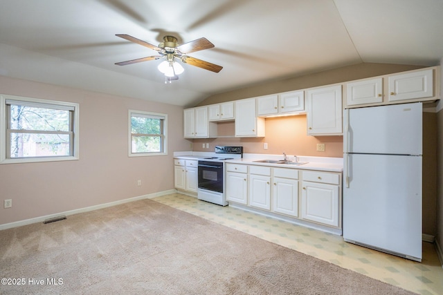 kitchen with white cabinetry, sink, ceiling fan, and white appliances