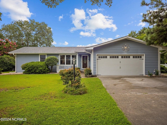 ranch-style home with a garage and a front lawn