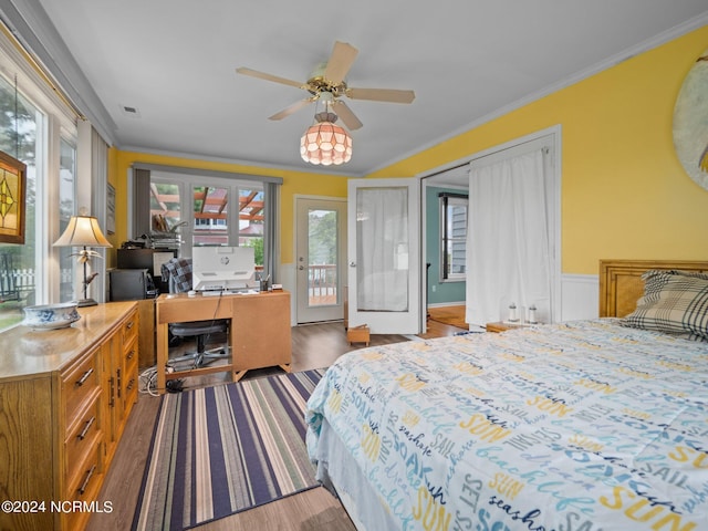 bedroom with ceiling fan, french doors, ornamental molding, access to outside, and hardwood / wood-style flooring