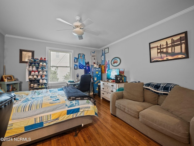 bedroom with hardwood / wood-style flooring, ceiling fan, and ornamental molding