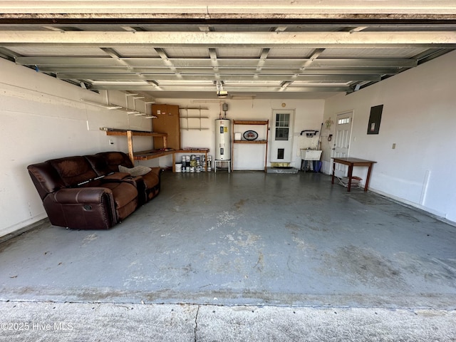 garage featuring sink, electric panel, and water heater