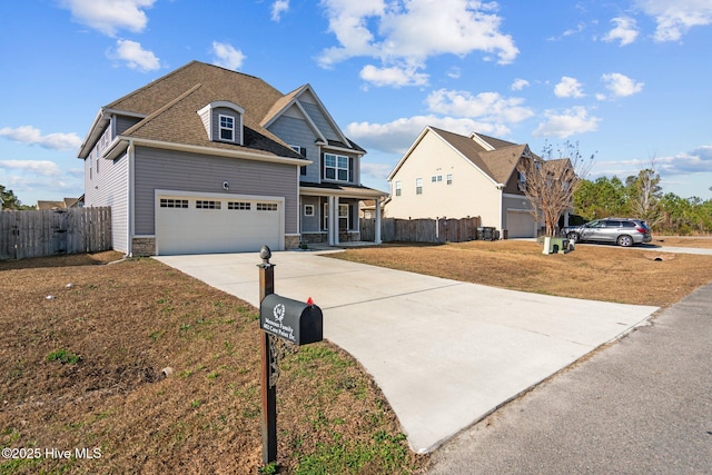 view of front facade featuring a front lawn and a garage