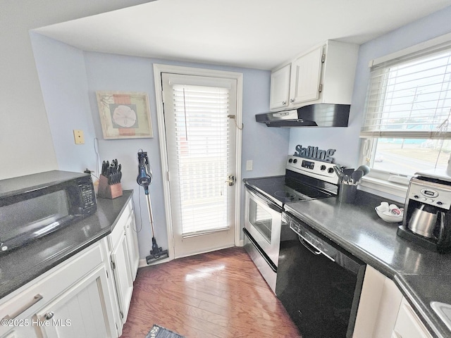 kitchen featuring under cabinet range hood, white cabinets, black appliances, dark countertops, and dark wood finished floors