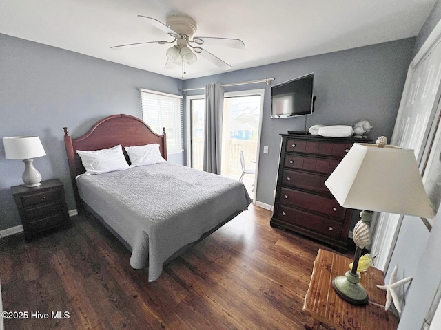 bedroom with dark wood-style floors, access to exterior, ceiling fan, and baseboards