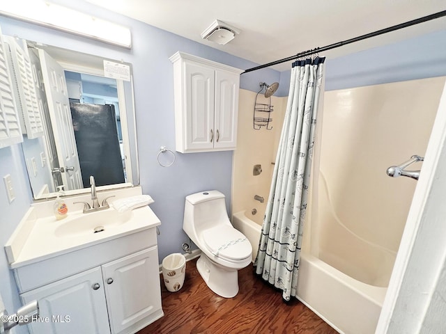 full bath with shower / bath combination with curtain, vanity, toilet, and wood finished floors