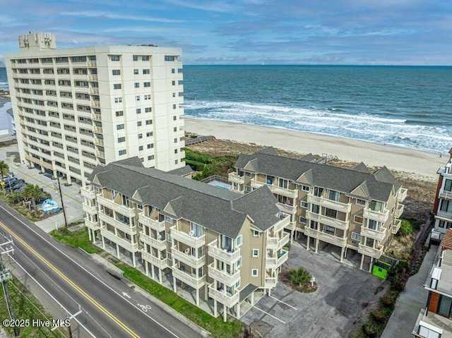 aerial view featuring a water view and a beach view