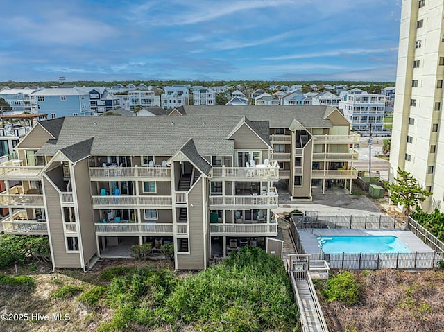 view of building exterior with a community pool