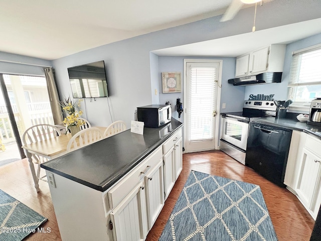 kitchen featuring under cabinet range hood, electric range, white cabinetry, dishwasher, and dark countertops