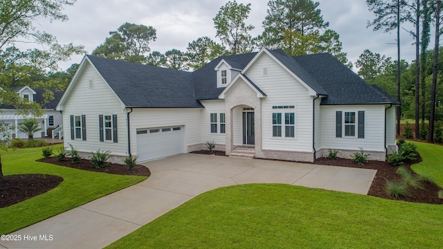 view of front facade with a garage and a front lawn