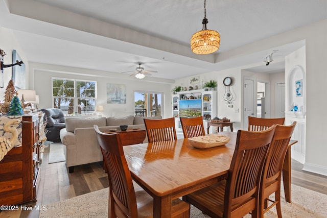 dining space featuring ceiling fan and hardwood / wood-style flooring