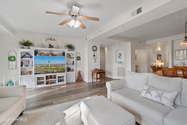 living room with hardwood / wood-style floors and ceiling fan