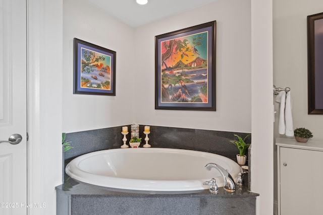 bathroom with tiled bath