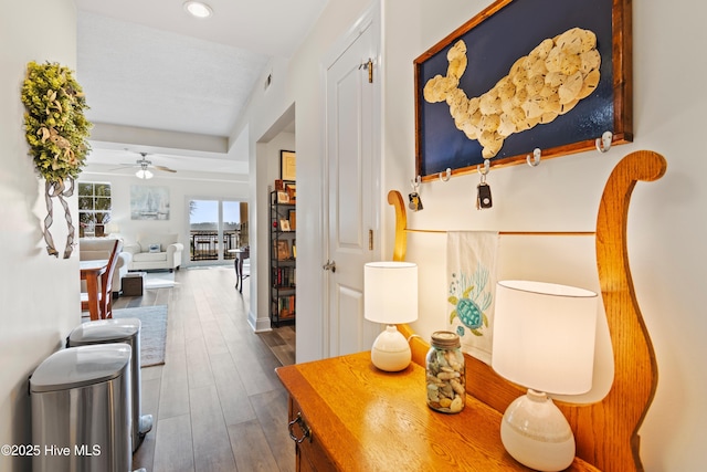 interior space with hardwood / wood-style floors and ceiling fan