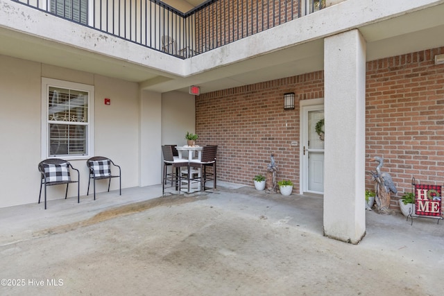 view of patio / terrace with a balcony