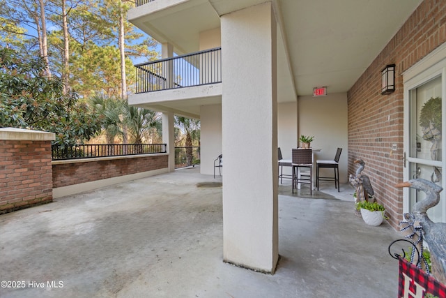 view of patio with a balcony