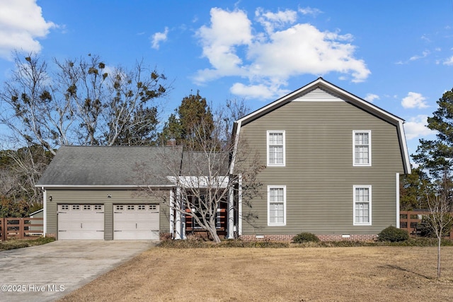 view of front of property featuring a garage and a front yard