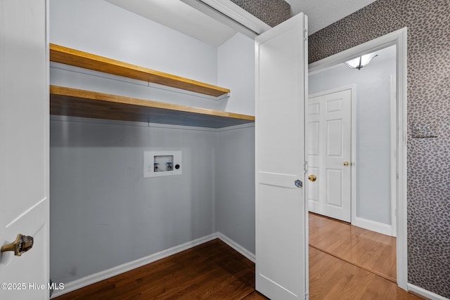 laundry room featuring washer hookup and hardwood / wood-style flooring