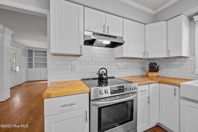 kitchen featuring backsplash, electric range, white cabinets, and wood counters