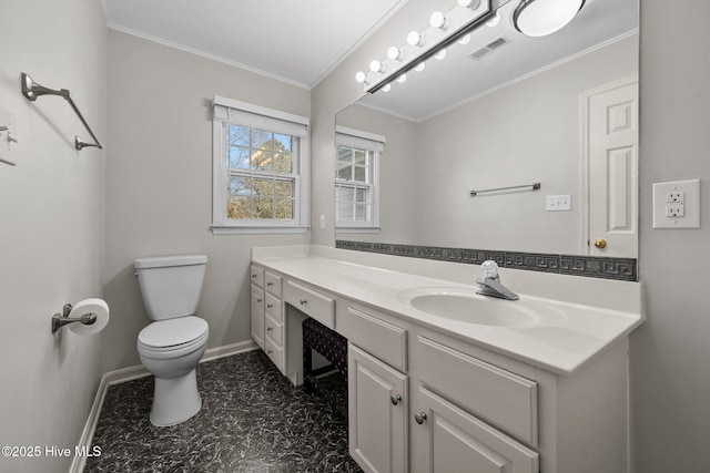 bathroom featuring toilet, vanity, and crown molding