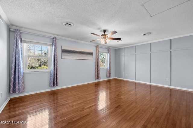 unfurnished room with ceiling fan, crown molding, a textured ceiling, and hardwood / wood-style flooring