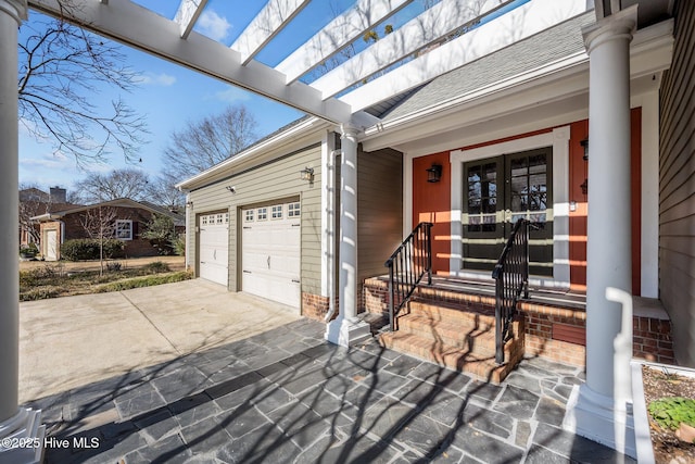 view of exterior entry featuring a garage