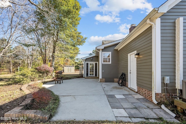 view of patio / terrace with a storage unit