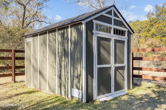 view of outdoor structure featuring a yard