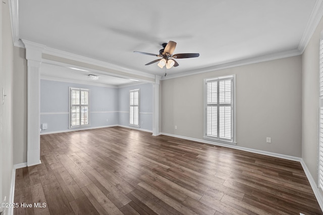 unfurnished room featuring plenty of natural light, crown molding, and decorative columns