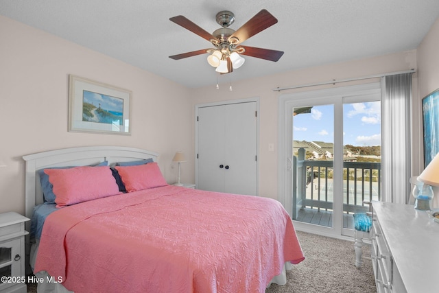 carpeted bedroom featuring a textured ceiling, a closet, access to outside, and ceiling fan