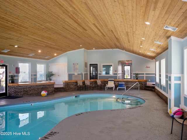 view of swimming pool featuring a jacuzzi