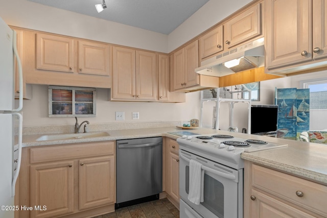 kitchen featuring light brown cabinets, white appliances, and sink