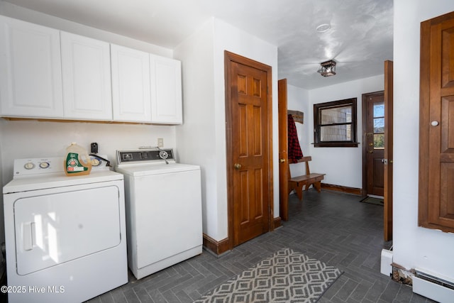 laundry room with washer and clothes dryer and cabinets