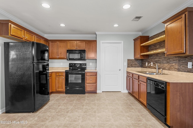 kitchen featuring sink, light tile patterned floors, tasteful backsplash, black appliances, and crown molding