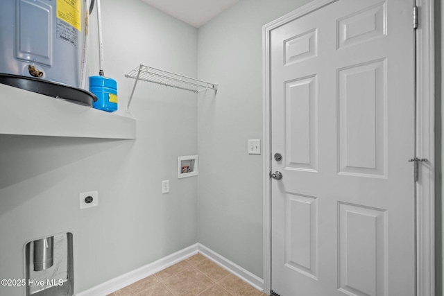 clothes washing area with water heater, light tile patterned flooring, washer hookup, and hookup for an electric dryer