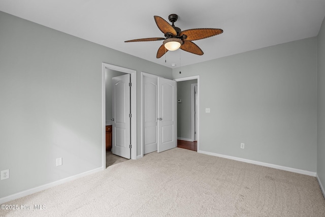 unfurnished bedroom featuring ceiling fan and light carpet