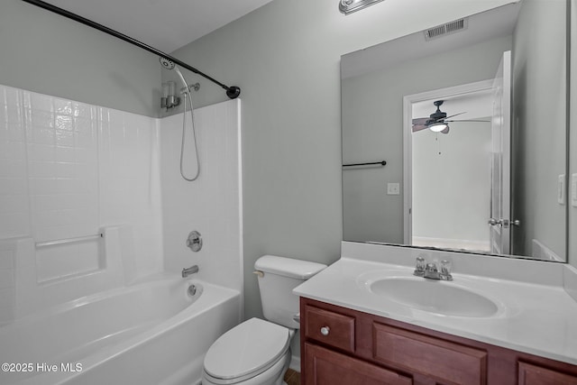 full bathroom featuring toilet, ceiling fan, bathing tub / shower combination, and vanity