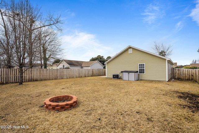 exterior space featuring a fire pit and central AC unit