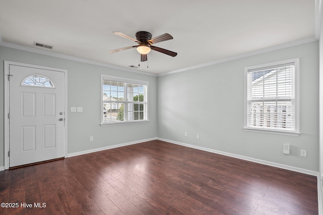 entryway with ceiling fan, dark wood-type flooring, and crown molding