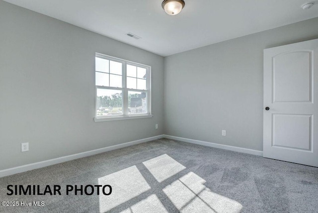 unfurnished room featuring carpet flooring