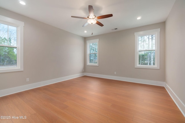 unfurnished room featuring light hardwood / wood-style flooring and ceiling fan