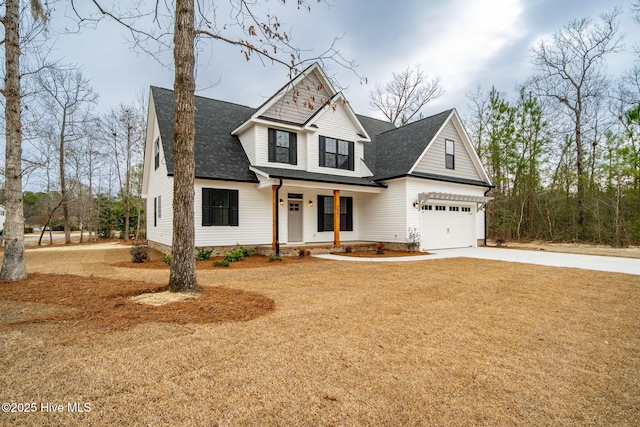 view of front facade featuring a garage and a porch