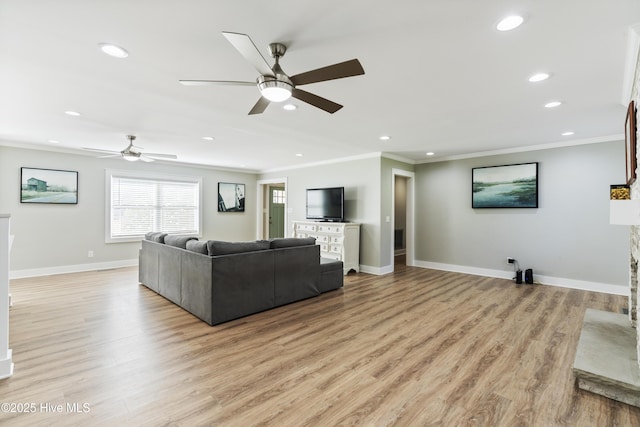 living room with ceiling fan, light hardwood / wood-style flooring, and ornamental molding