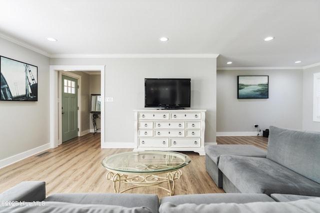 living room featuring light hardwood / wood-style floors and ornamental molding