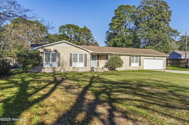 ranch-style house featuring a garage and a front lawn